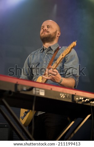 Traena, Norway - July 12 2014: during the concert of the Icelandic singer Mugison at the Traenafestival, music festival taking place on the small island of Traena