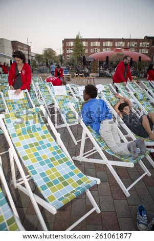 Amsterdam, The Netherlands, 12-14 September 2014, at West\'ival, a free open air Cinema and culture festival on Mercatorplein.preparation before the screening, people hanging around, children playing