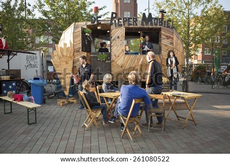 Amsterdam, The Netherlands, 12 September 2014, at West\'ival, a free open air Cinema and culture festival on Mercatorplein. before the screening, preparation, people hanging around