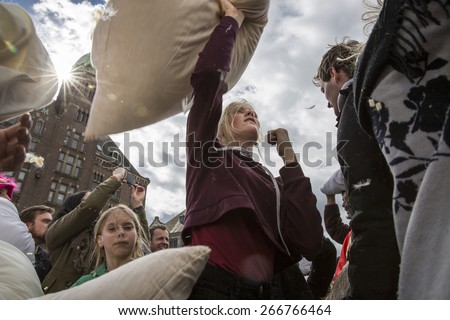 Amsterdam, The Netherlands, Noord Holland - Saturday, April 4 2015 - Pillow Fight on Dam Square as part of the international pillow fight day held in several cities in the world