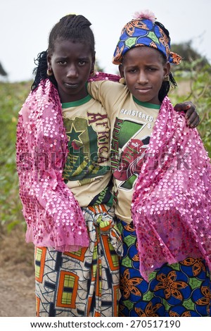 SENEGAL, Ferlo reserve, November, 2 2013: young girls in traditional outfit on the way to school.