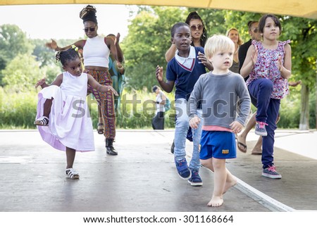 Amsterdam, The Netherlands - July, 5 2015: African dance workshop during Amsterdam Roots Open Air, a cultural festival held in Park Frankendael on 05/07/2015
