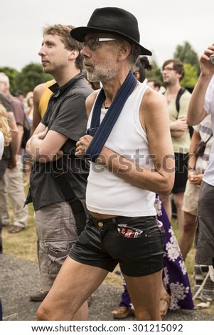 Amsterdam, The Netherlands - July, 5 2015: thin middle age man in a leather short during Amsterdam Roots Open Air, a cultural festival held in Park Frankendael on 05/07/2015