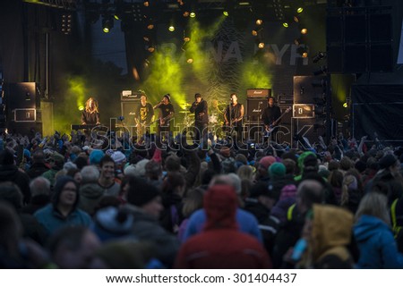 Traena, Norway - July 9 2015: crowd watching the concert of Norwegian rock band OnklP & De Fjerne Slektningene at the Traenafestival, music festival taking place on the small island of Traena