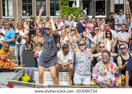 Amsterdam, Netherlands - August 1, 2015: participants in the annual event for the protection of human rights and civil equality - Gay Pride Parade on the Prinsengracht, Amsterdam