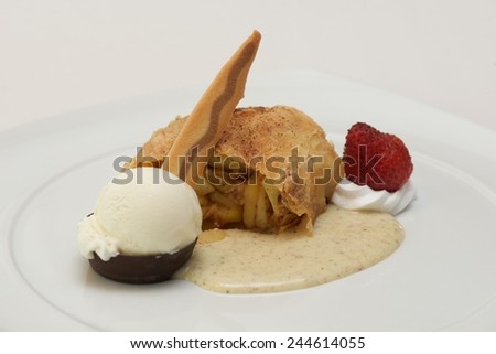 Apple strudel with cinnamon sauce and ice-cream