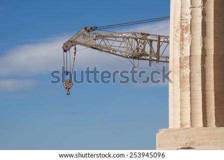 Crane appearing from behind marble Parthenon column