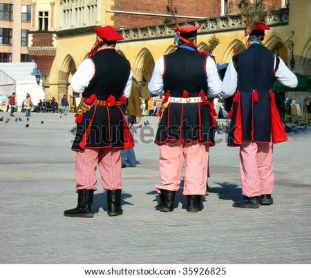 men dressed in national Krakow costumes