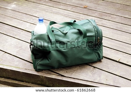 green bag with bottle of milk