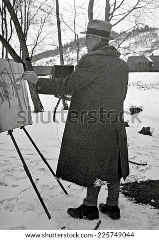ZAKOPANE,POLAND - CIRCA 1935: vintage photo of young artist painting landscape