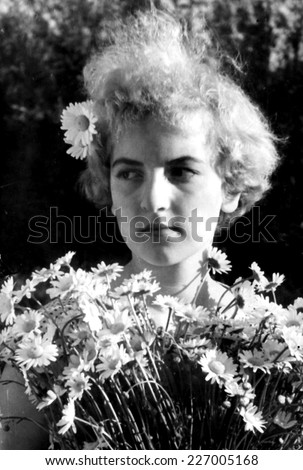 JASLO,POLAND - CIRCA 1959 : vintage photo of girl with flowers