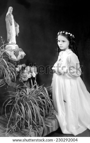 JASLO,POLAND - CIRCA 1959 : vintage photo of vintage photo of girl receiving First Holy Communion