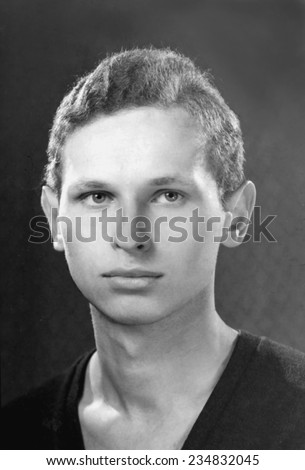 JASLO,POLAND - CIRCA 1962 : vintage atelier photo of young man