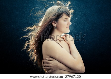 Young beautiful girl with fluttering hair