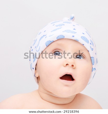 Small surprised baby with open mouth