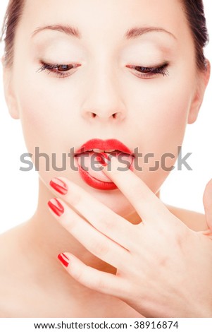 stock photo Young pretty girl licking her finger portrait