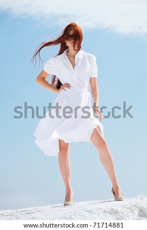 Young pretty girl in white dress