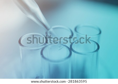 chemical dropper and science test tube background , vintage color