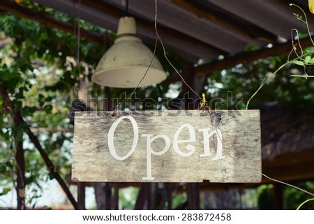 open word on wooden hanging board