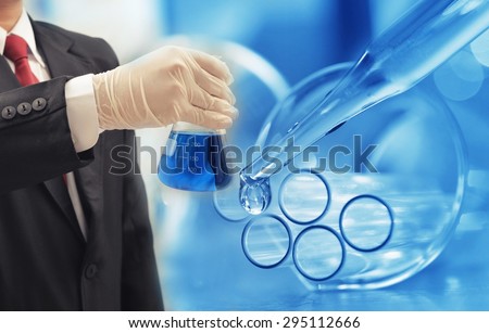 business man research chemistry at science lab