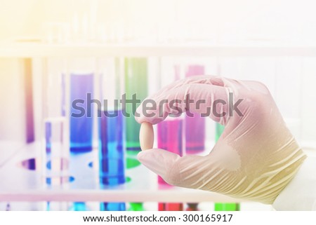 testing medicine at science lab , pharmaceutical concept