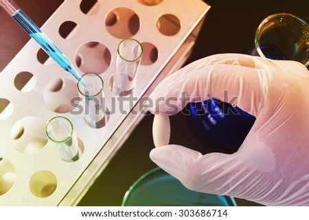 chemistry researching medicine at science lab , pharmaceutical background
