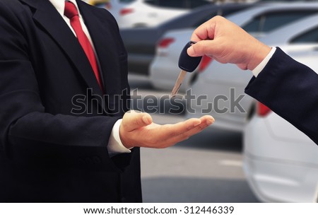business man give car key