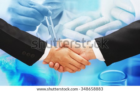 business man shake hand and medical research background