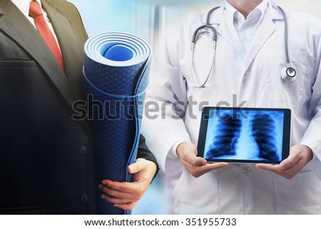 business man holding yoga mat and doctor show scan result