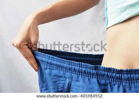 woman lose weight , diet concept background