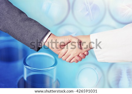business man hand shake with scientist