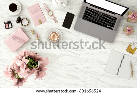top view working space with laptop,smartphone,flower,cup of coffee and cosmatics  for Beauty and fashion designer,marble background