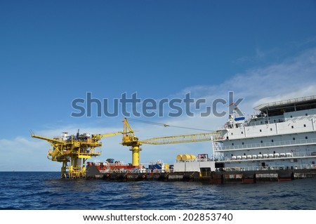 barge and tug boat in open sea,Oil and gas platform in the gulf or the sea, The world energy, Offshore oil and rig construction