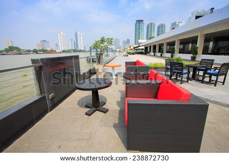 restaurant seats and tables near the river, restaurant interior
