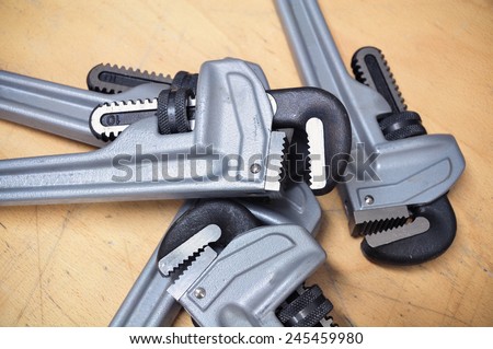 Tools set in vintage picture style . set of hand tools on a wooden background, Wrench tools or Pipe wrench for hard work.