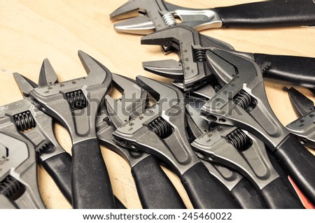 Tools set in vintage picture style . set of hand tools on a wooden background, Wrench tools or Pipe wrench for hard work.