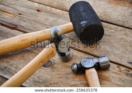 Hammer set of hand tools or basic tools on wooden background.