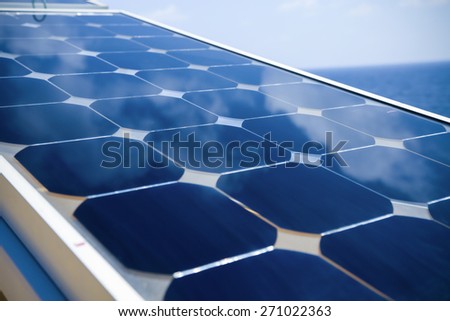 Solar cell generated electrical power by sun light, Closeup of blue photovoltaic solar panels, Green energy for safe world.