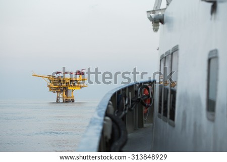 Oil and gas construction in the sea and view from supply boat, Production platform in oil and gas industry, Oil and gas business.