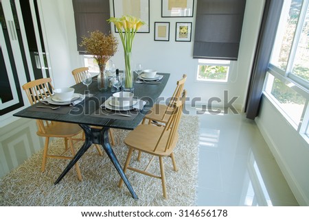 Dining table with set in modern home, Wooden table in Dining room, Luxury corner in the family.