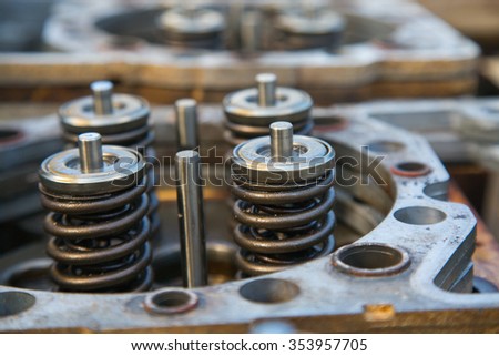 model of a vehicle engine, engine exhaust valve and intake valve, spring valve of the engine and auto spare parts, machine parts damaged from work.