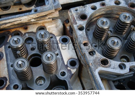 model of a vehicle engine, engine exhaust valve and intake valve, spring valve of the engine and auto spare parts, machine parts damaged from work.