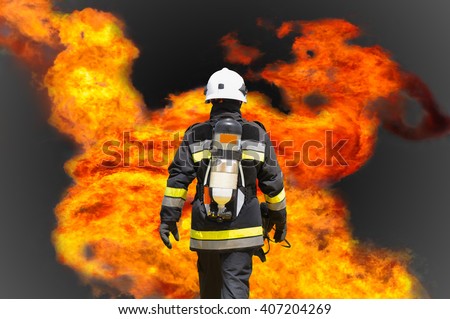 Fire fighter on oil and gas industry, successful firefighter at work , Fire suit for fighter with fire and suit for protect fire fighter, Security team when fire case.