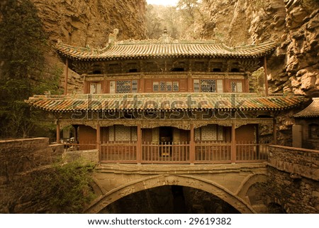 ancient temple constructed on a bridge over a deep canyon in Hebei province, China