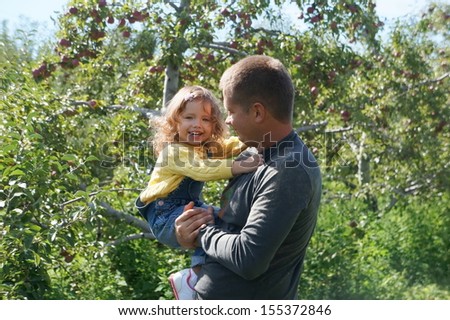 Father and daughter in the garden