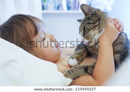 Friends-a child and a cat