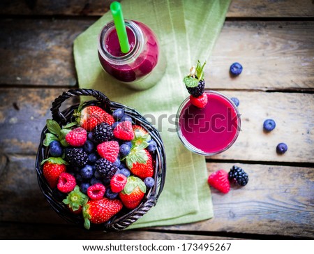 Berry Smoothie On Rustic Wooden Background