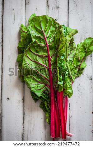 red chard on wooden background