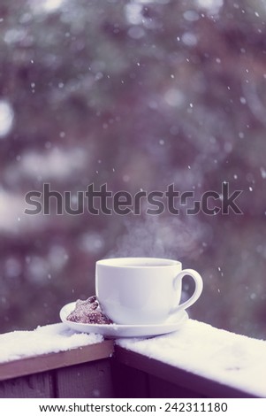 Cup of hot tea and cookies outside