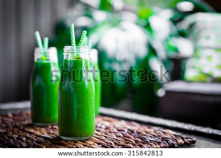 Fresh green smoothie outdoors
